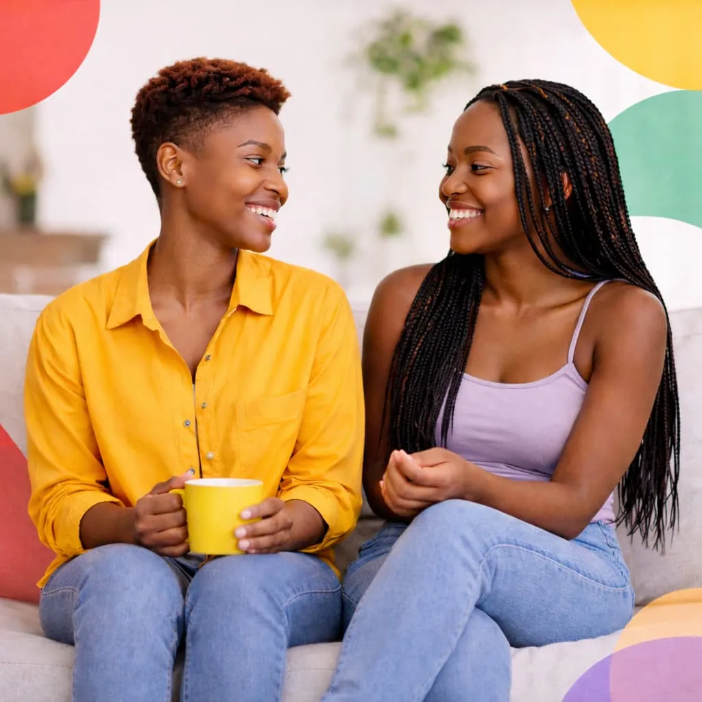 Two queer women sitting together and chatting comfortably